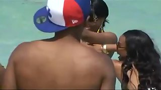Bare-breasted black queen unveils her enrapturing big bra-stuffers at the beach