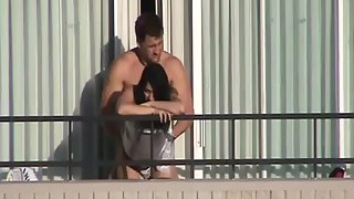 Couple caught boinking on high rise balcony